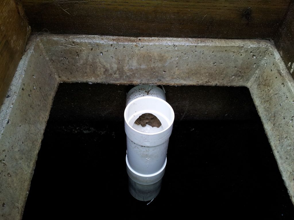 Unused inlet showing grout/concrete seal